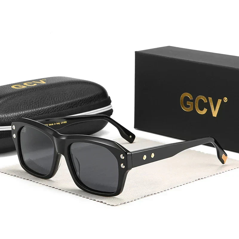 Black sunglasses with gold accents on a white background, featuring GCV branding.