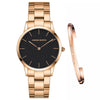 Rose gold watch and bracelet set with black dial on a white background
