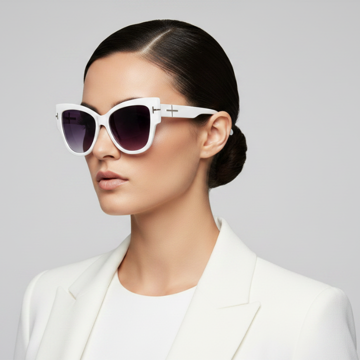 Woman wearing white sunglasses with a gray background
